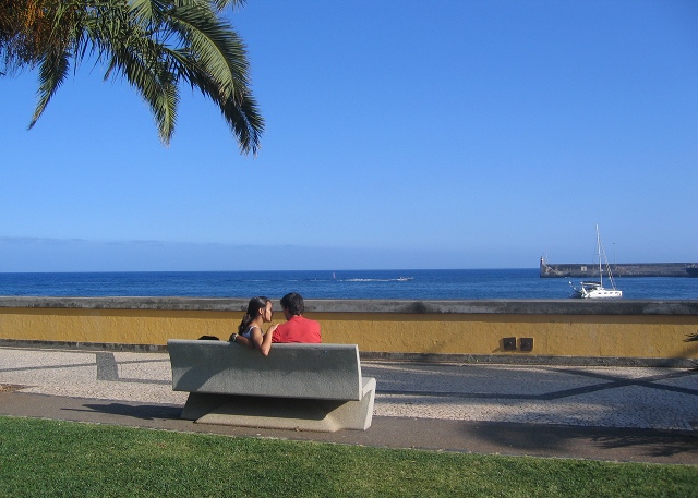 Couple sitting together on bench