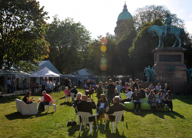 Edinburgh Book Festival. Shows people in a park enjoying the literary festival