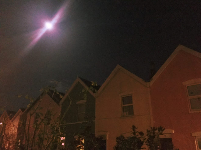 Moon and roofs by Judy Darley