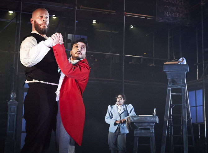 Felix Hayes, Saikat Ahamed and Nadia Nadarajah in A Christmas Carol at Bristol Old Vic, credit Geraint Lewis