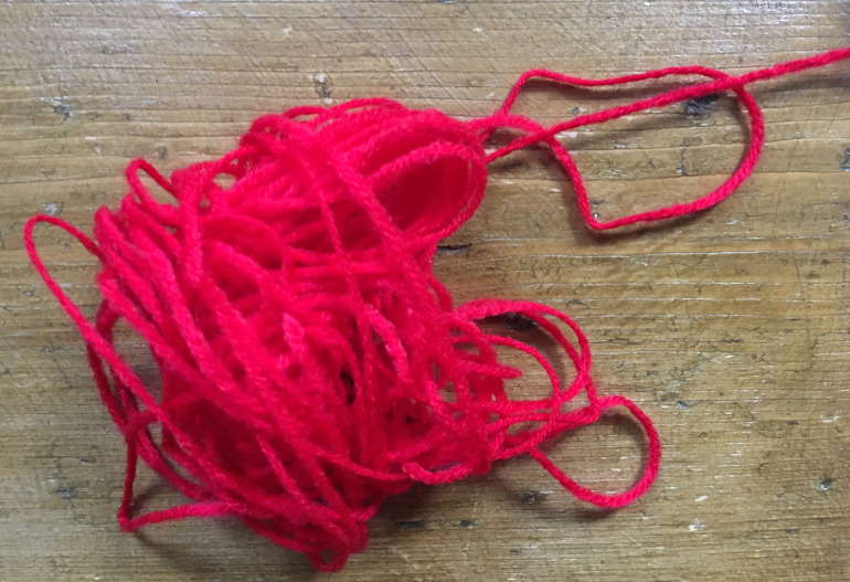 Red yarn by Judy Darley