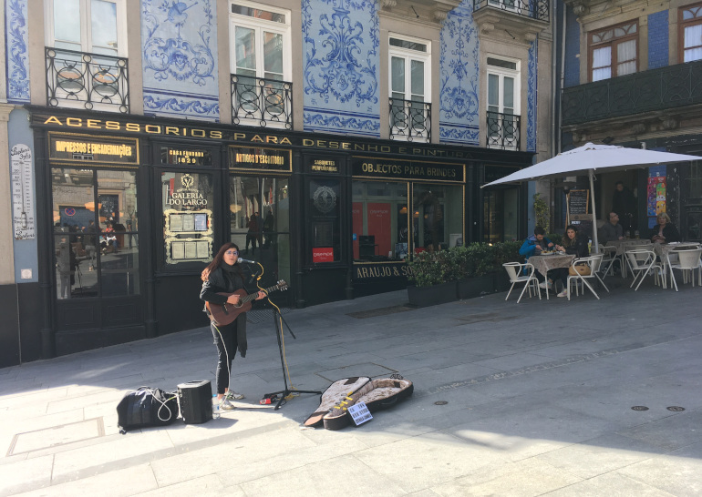 Porto busker on Rua das Flores by Judy Darley