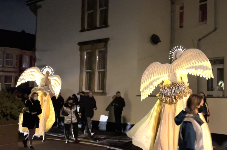 Corvus Angelica. Photo of illuminated stilt walkers by James Hainsworth.