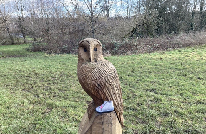 Owl carving and baby shoe by Judy Darley