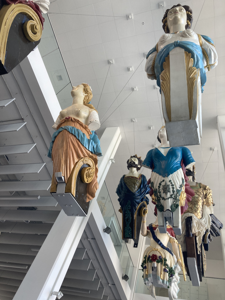 Victorian naval figureheads suspended from the ceiling of Plymouth museum The Box_Photo by Judy Darley