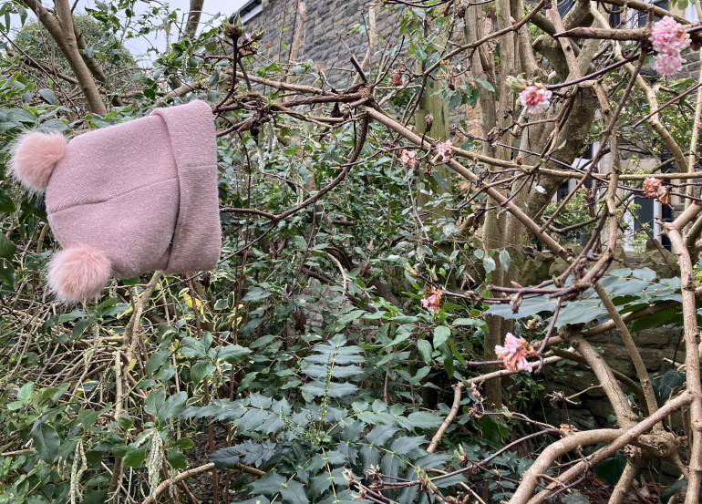 Pink hat and flowers_Photo by Judy Darley